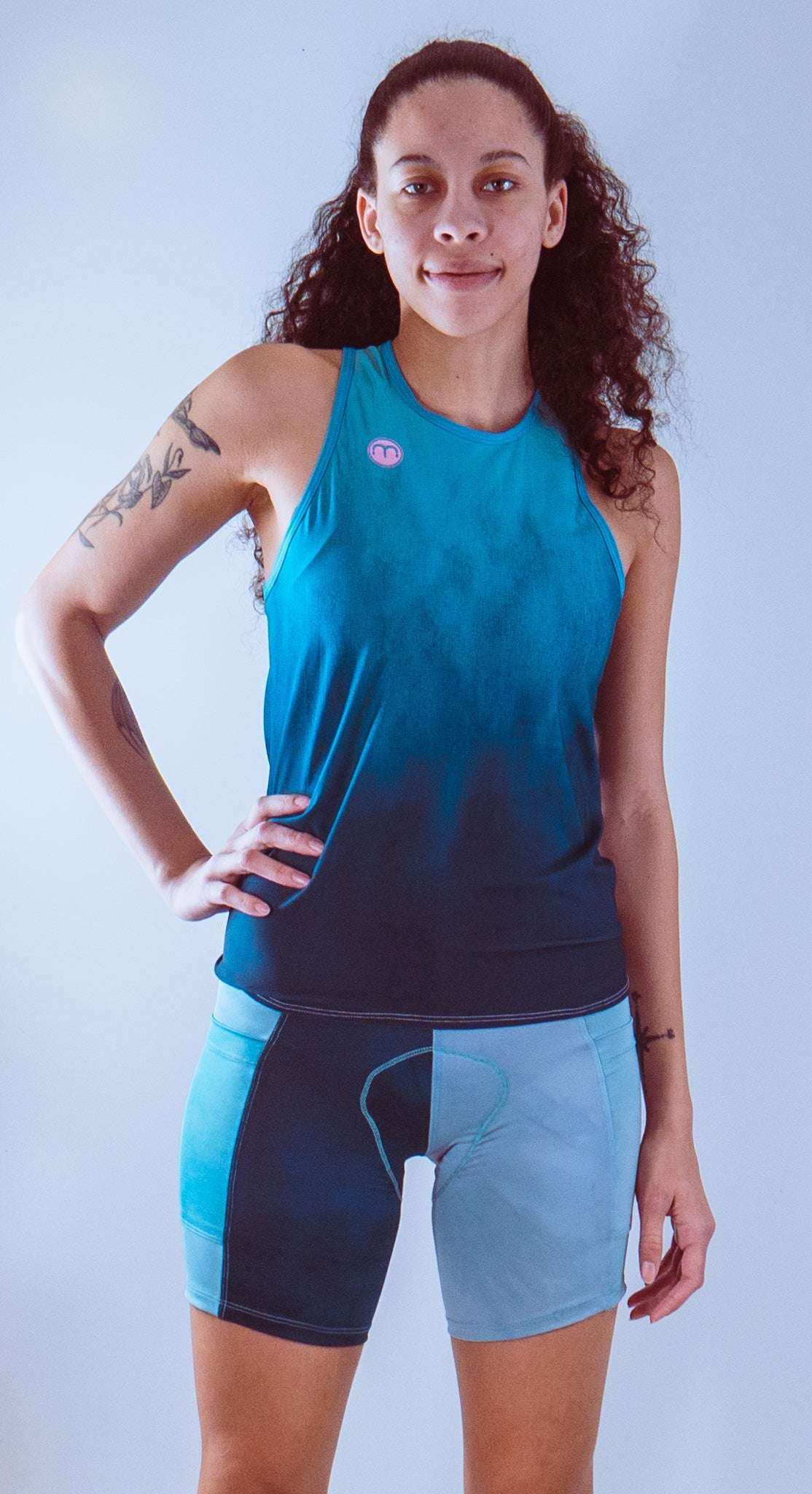 Women's bike shorts with 7" inseam and Italian chamois in baby blue, featuring moisture-wicking fabric and contoured fit.